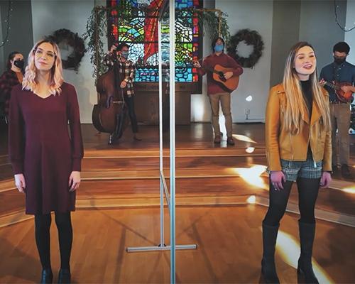 students singing in the good shepherd chapel