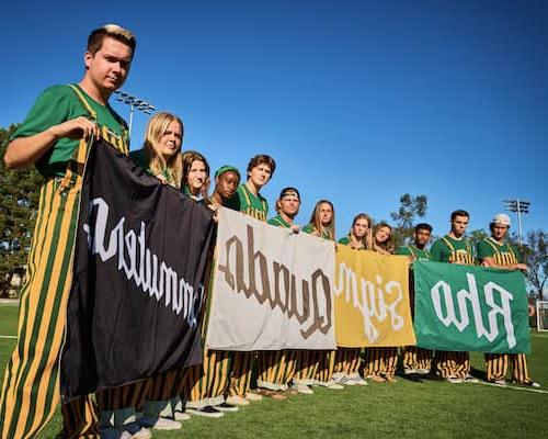 A group of people holding up flags