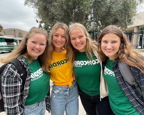 Four girls smiling for a photo