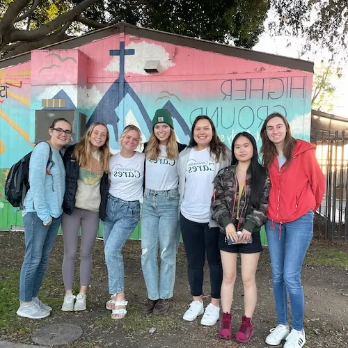 a group of students posing for a group photo at higher ground